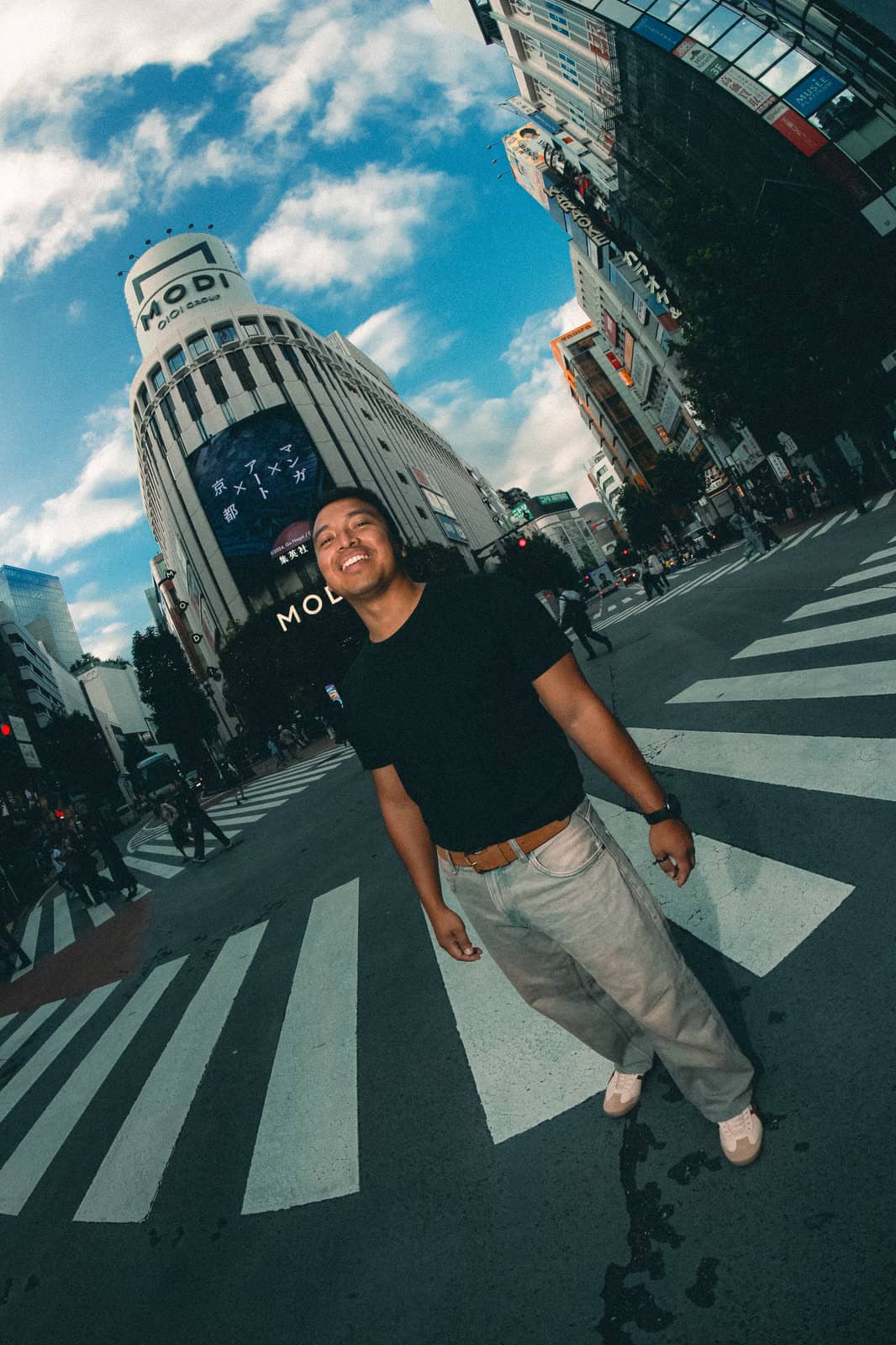 Man on a Tokyo crosswalk on a sunny day