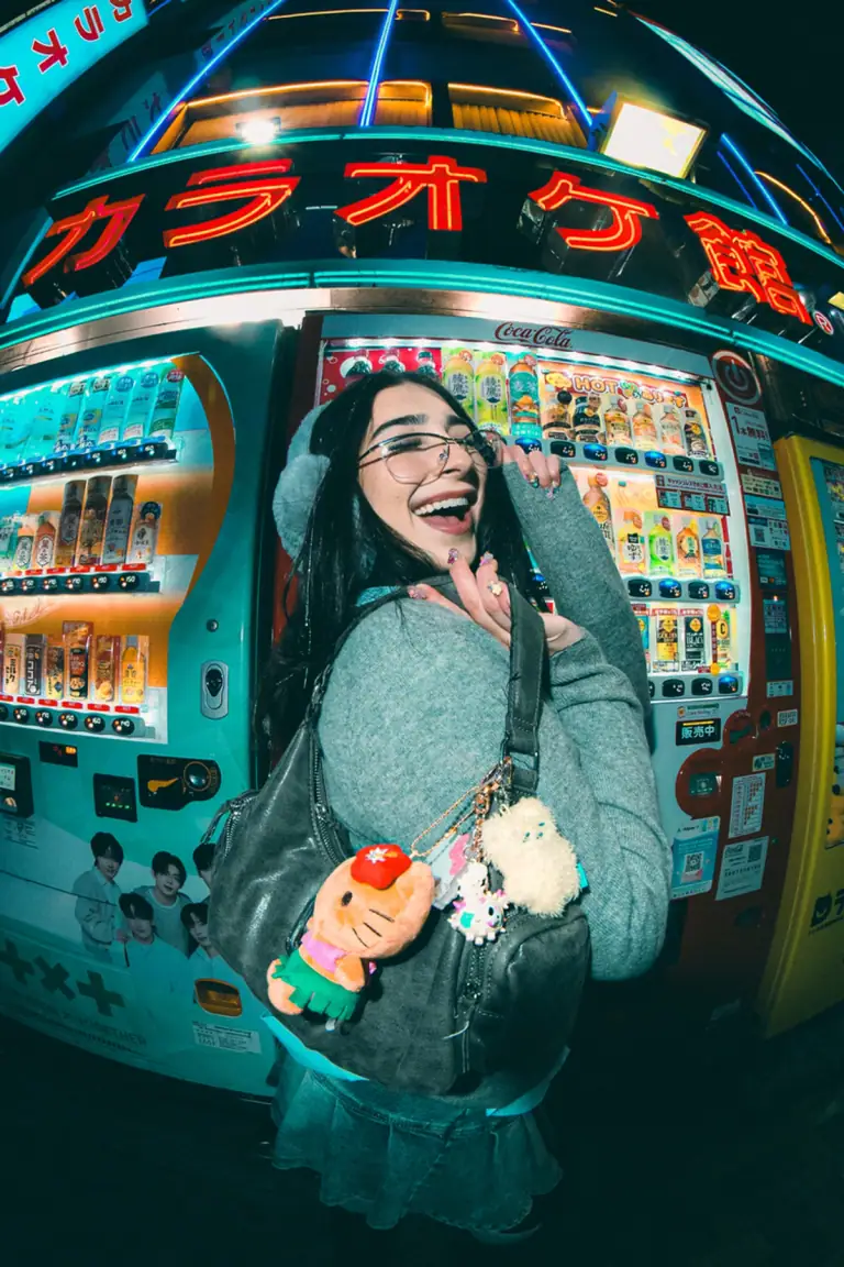 A cute portrait with a character plush at a vending machine