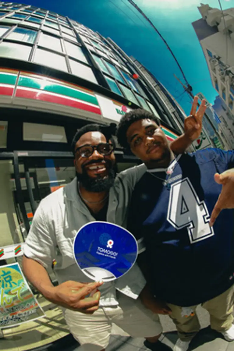 Friends outside a Tokyo convenience store in midsummer